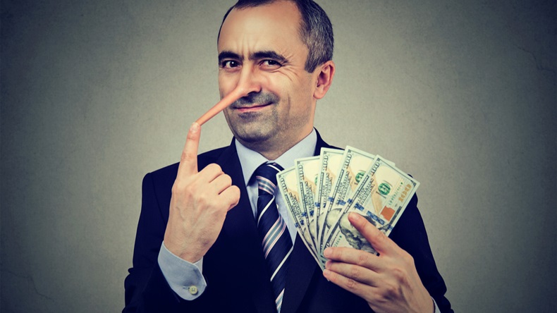 Financial fraud concept. Liar businessman with dollar cash - Image 