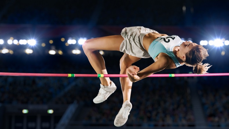 female athlete performing high jump 