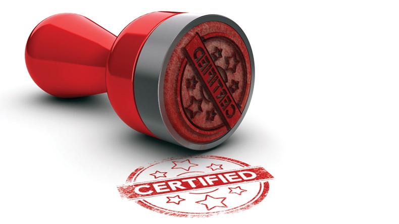 Rubber stamp over white background with the text certified printed on it. concept image for illustration of certification or guarantee certificate.